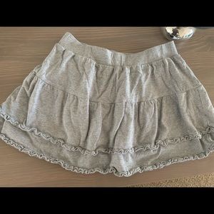 Pony tails grey skirt